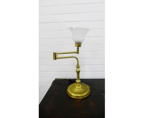 A brass table lamp with opaque glass shade, 47cm high