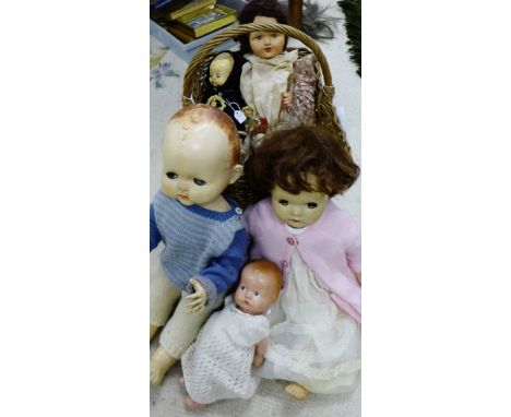 A basket containing a collection of ten vintage dolls to include Pedigree and Horshman etc (10) 