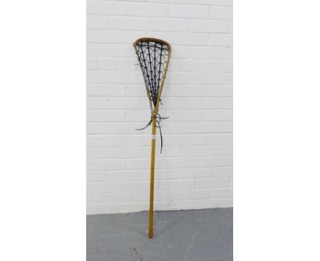 A vintage lacrosse stick, stamped 'Viktoria, Eccles, Lancs'