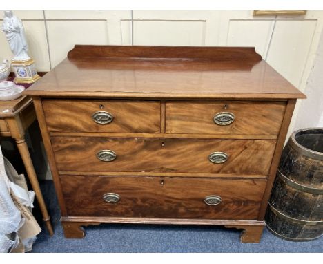 A 19th century mahogany chest of two short over two long graduated drawers with brass oval wheatsheaf drop handles, on bracke