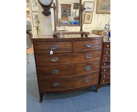 A 19th century mahogany bow front chest of two over three drawers with oval drop handles and ribbon and harebell back plates 