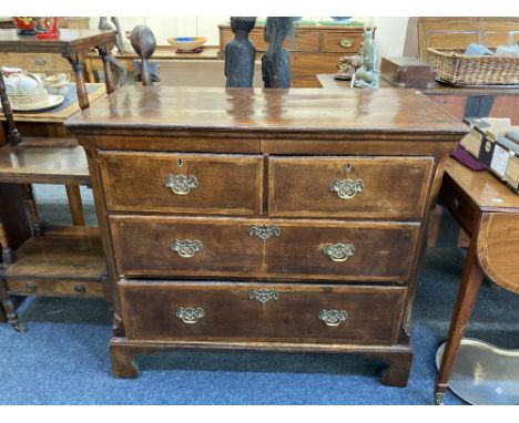A George III mahogany chest of two short over two long drawers, with cross banding and herringbone inlay, on bracket feet, 10