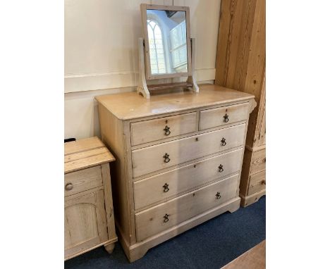 A pine chest of two short over three long drawers, on bracket feet, 98cm, together with a similar swing mirror, 56cm high