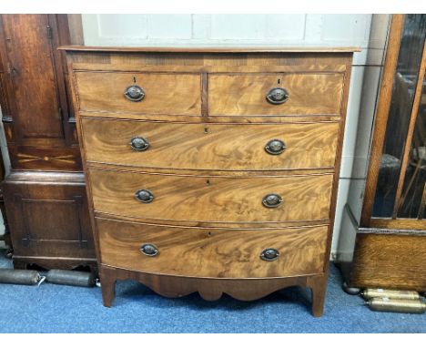 A 19th century mahogany bow front chest of two short over three long drawers, with oval drop handles stamped with the Prince 