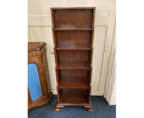 A mahogany narrow waterfall bookcase, of five graduated shelves, on bracket feet, 48cm wide by 120cm high