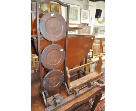 An Edwardian Sutherland table, folding cake stand, key design hat and coat rack and another.