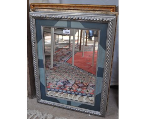A silvered framed wall mirror and various prints.