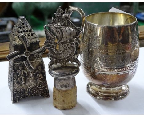 A silver ship design decanter stopper, Dutch silver cruet in the form of a windmill, Christening mug and a plated Christening
