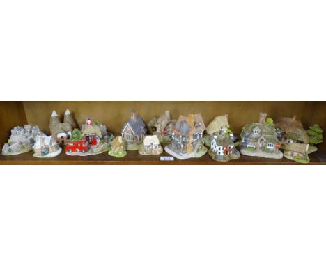 A shelf of Lilliput Lane cottages and Edinburgh Castle.