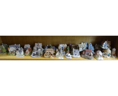 A shelf of David Winter and Lilliput Lane cottages.