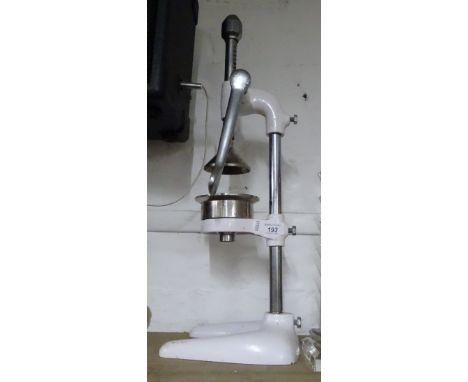 A Vintage enamel and chrome crusher.