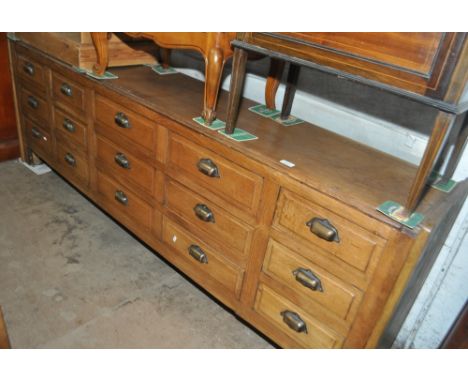 A Vintage low oak 15-drawer haberdashery cabinet, length 207cm, height 71cm, depth 39cm.