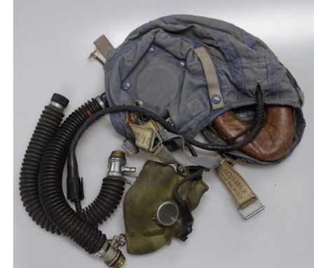 An RAF pilot's flying cap 1958, with oxygen mask, hoses and aircraft joy stick.