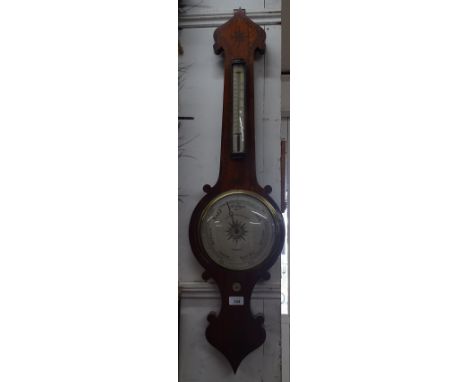 An inlaid aneroid wall barometer by G Spiegelhalter & Co., London.
