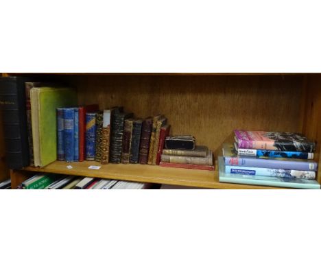 Shelf of leather bound and mountaineering books.