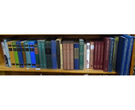 A shelf of folio edition books including paintings and Trollope.