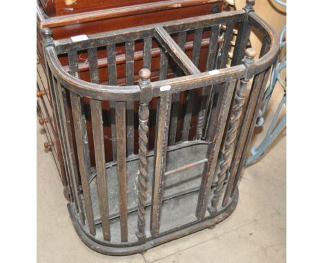 A 1920s oak demi lune stick stand.