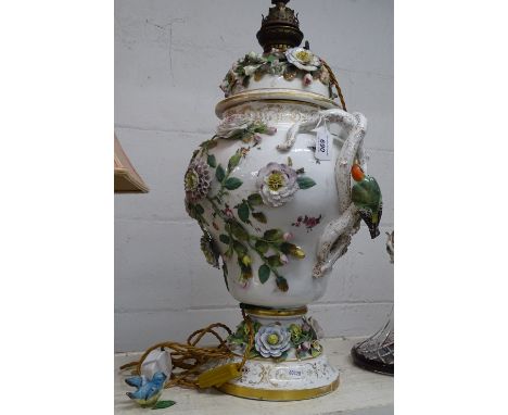 Large continental porcelain table lamp in 3-sections with applied birds and flowers.