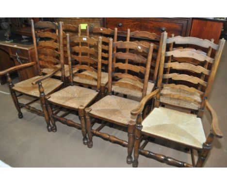 A set of 8 oak ladder back rush seated dining chairs, (6+2).