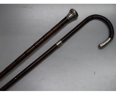 A silver topped bamboo walking cane and a silver mounted walking stick, (2).