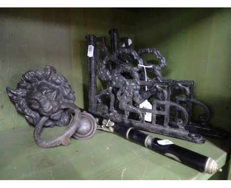 Pair of cast-iron brackets, an iron lion knocker, etc.