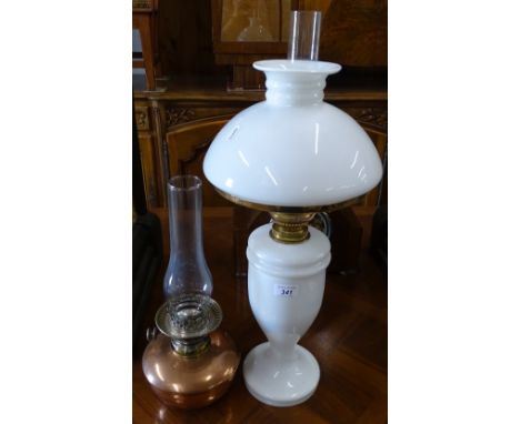 An Edwardian milk glass oil lamp with shade and chimney, and a copper oil lamp.