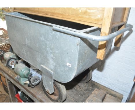 A Vintage galvanised metal industrial 3-wheeled trolley, length 117cm.