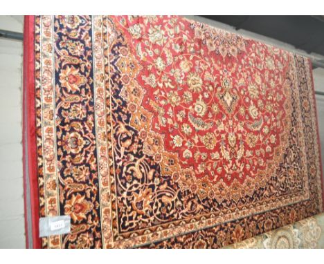 A red ground Keshan carpet, 230 x 160cm.