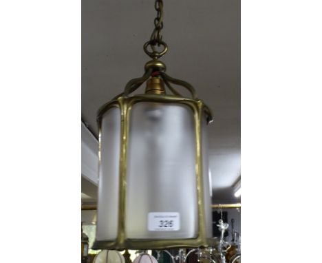 A small round brass hall lantern.