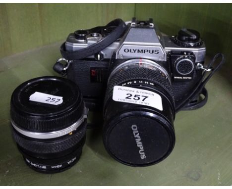 An Olympus camera and lens.