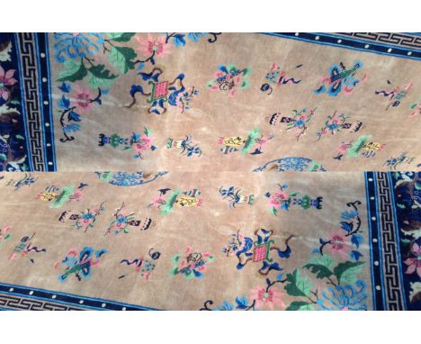 A large Chinese design brown and blue ground embossed carpet, 420 x 340cm.