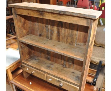 A small pine hanging shelf with 2 drawers, width 64cm.