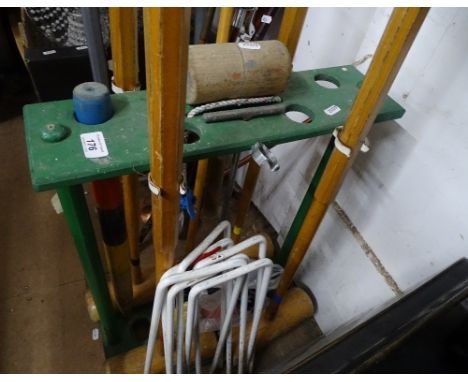 Vintage croquet set in fitted stand.