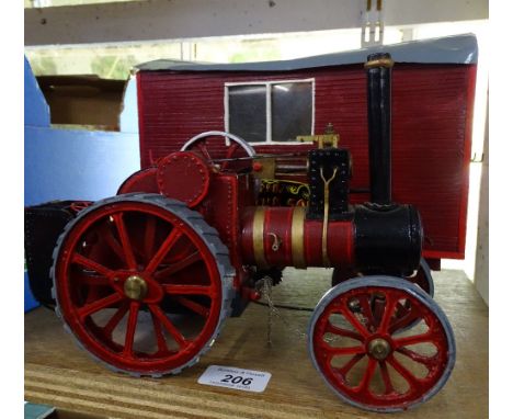 A modern steam tractor and wagon.