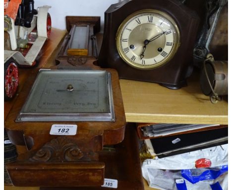 Aneroid barometer and a mantel clock.