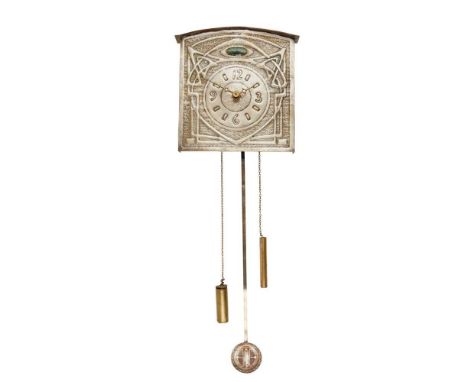 repoussé-decorated tin, inset with enamel panel, with associated pendulum and weightsdial 32cm x 31.5cm
