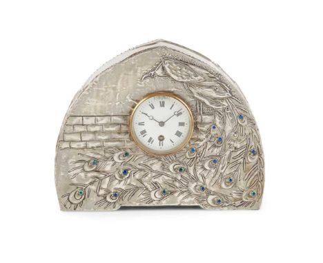 the circular enamel dial set within a pewter-lined arched case, decorated with applied blue/green enamels26cm high