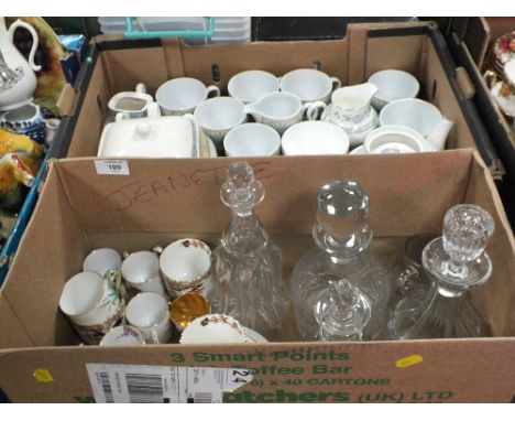 A BOX DECANTERS TO INCLUDE CUT GLASS EXAMPLES AND A SELECTION OF VINTAGE CUPS AND SAUCERS TO INCLUDE R.S SUHL, COALPORT ETC. 