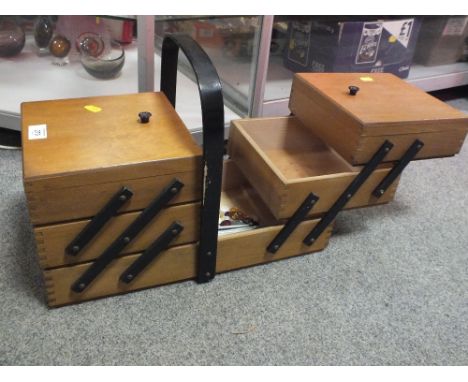 A VINTAGE FOLD OUT SEWING BOX AND CONTENTS