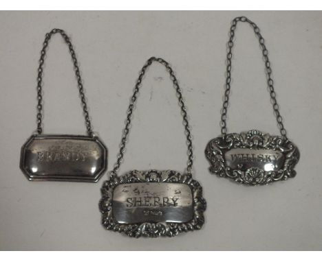 THREE HALLMARKED SILVER DECANTER LABELS
