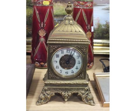 A 20TH CENTURY GILT METAL MANTEL CLOCK, of square form, the circular dial with Arabic numerals, outer minute track and centra