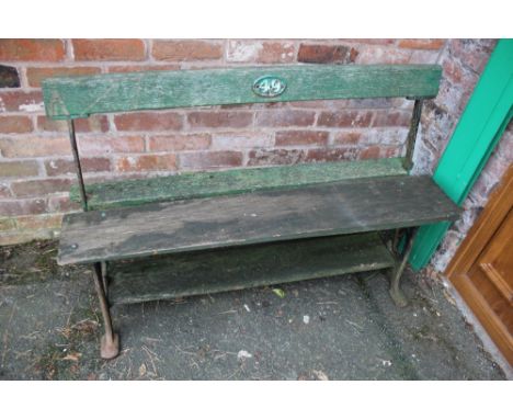 A SMALL VINTAGE GARDEN BENCH WITH CAST ENDS
