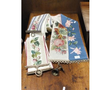 A COLLECTION OF SEVEN UPHOLSTERED TAPESTRY CUSHIONS AND BANNERS