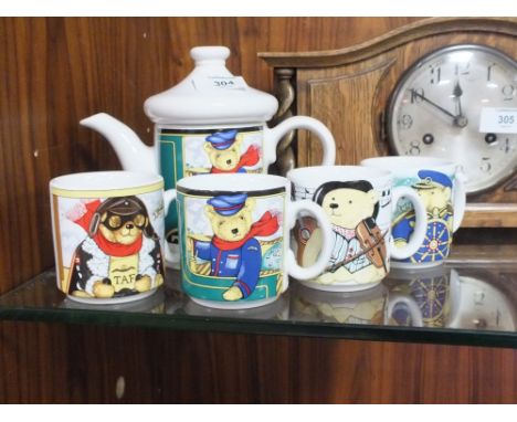 A WADE LOCOMOTIVE JOE TEAPOT AND FOUR MUGS (5) 