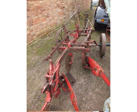 A VINTAGE CAST TWO FURROW PLOUGH ¦NOTE - SITUATED AT THE SIDE OF THE BUILDING