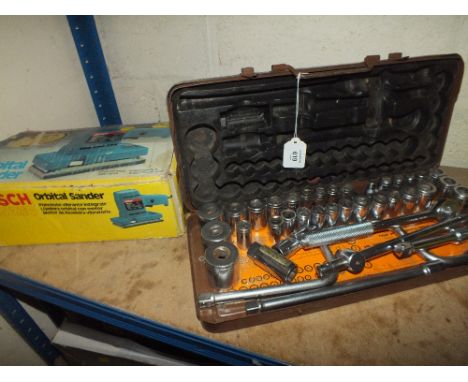 A CASED SOCKET SET PLUS A BOXED SANDER AND A WORK BENCH