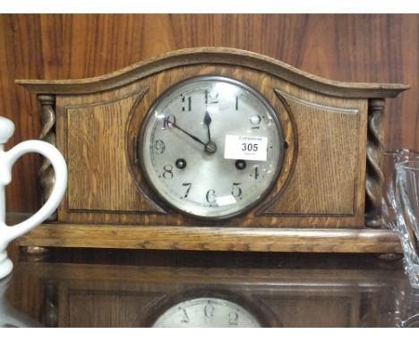 AN OAK BARLEY TWIST MANTEL CLOCK