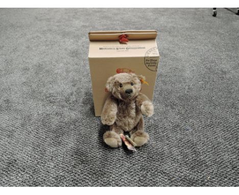 A modern Steiff Bear, Classic Teddybear 26 having yellow tag 030499, height 25cm and boxed with paper bag