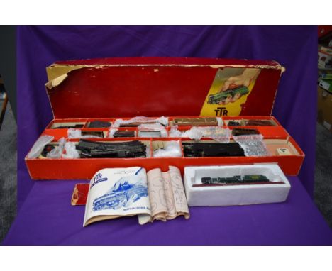 A TTR Trix Twin Railway Goods Train Set No 2/324 comprising, LMS 0-4-0 Loco &amp; Tender, seven Wagons, Yard Lamp in original