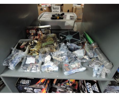 A shelf of modern Kenner and Hasbro Star Wars figures and accessories